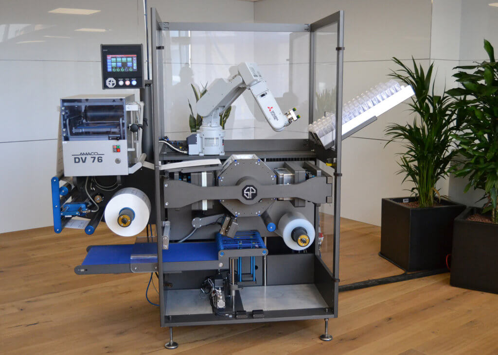 Why Production Robots are worth a second look - Mitsubishi production robot inside a protective enclosure image