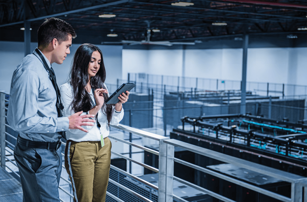 Remote Safety Audits Lower Risks For Manufacturers image showing a aman and a woman overseeing a factory